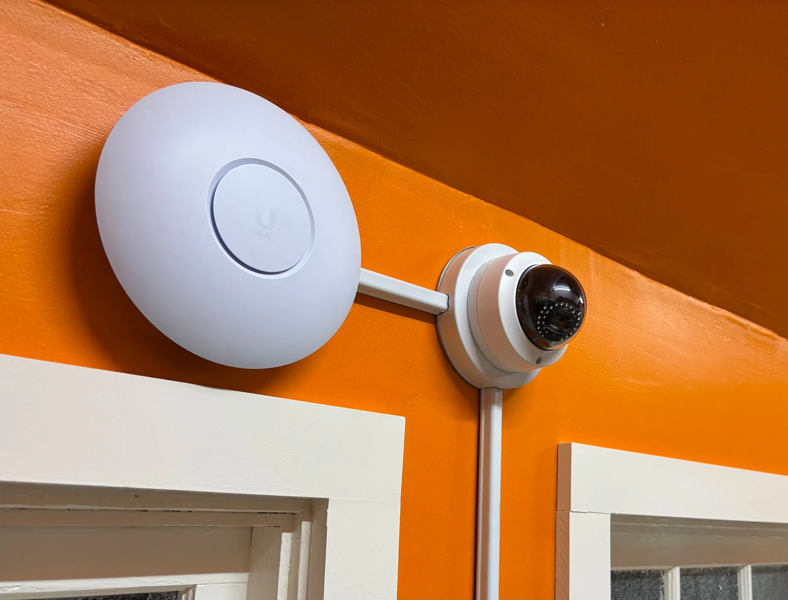 Wi-Fi access point and camera installed with 500 surface raceway at a coffee shop in Suffolk County.